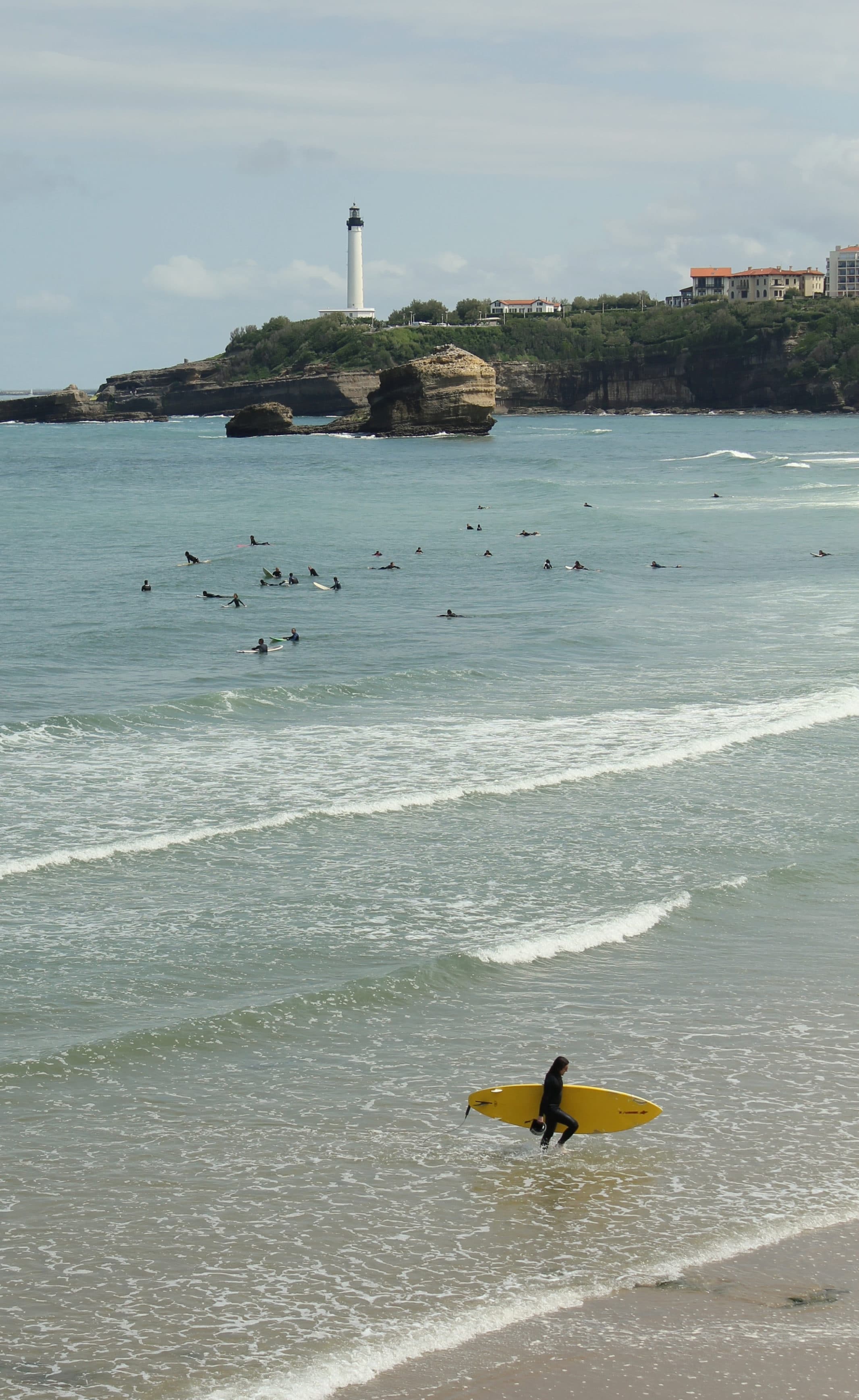 Biarritz lighthouse and surfers