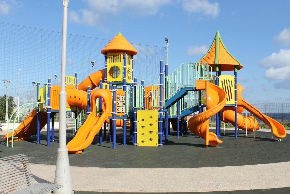 A nearby neighborhood playground gives kids space to run around and parents a chance to connect with locals.