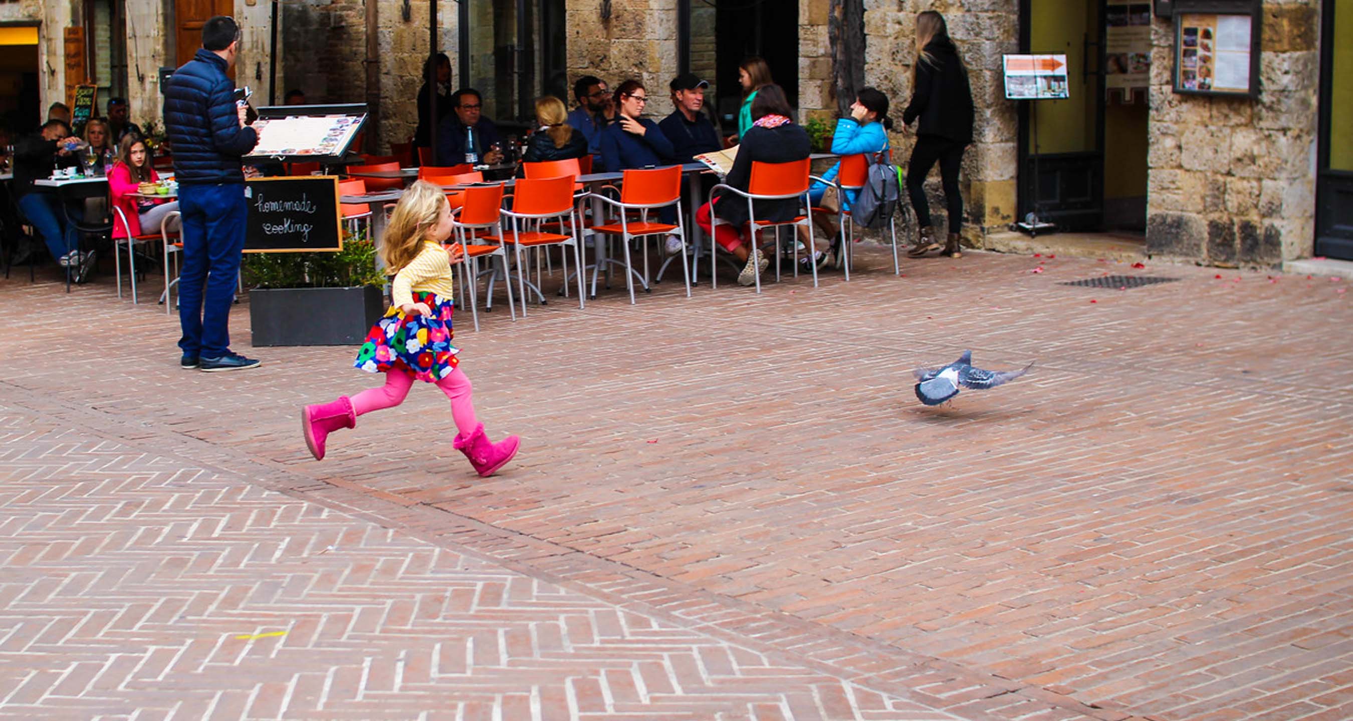 Girl running on an Italian street