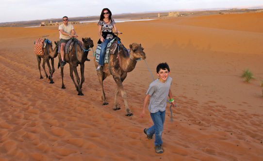 little-boy-leading-camel-trek-erg-chebbi