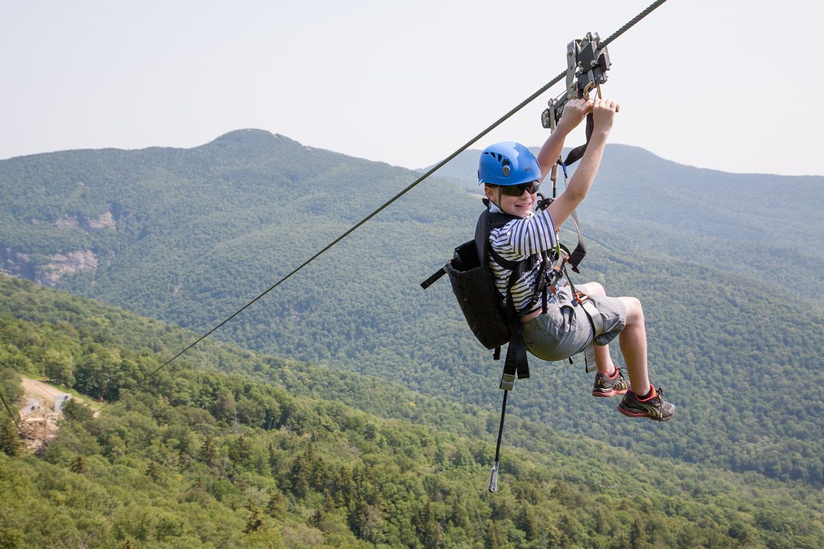 Zipping over the green hills of Vermont. Photo by Stowe Mountain Resort