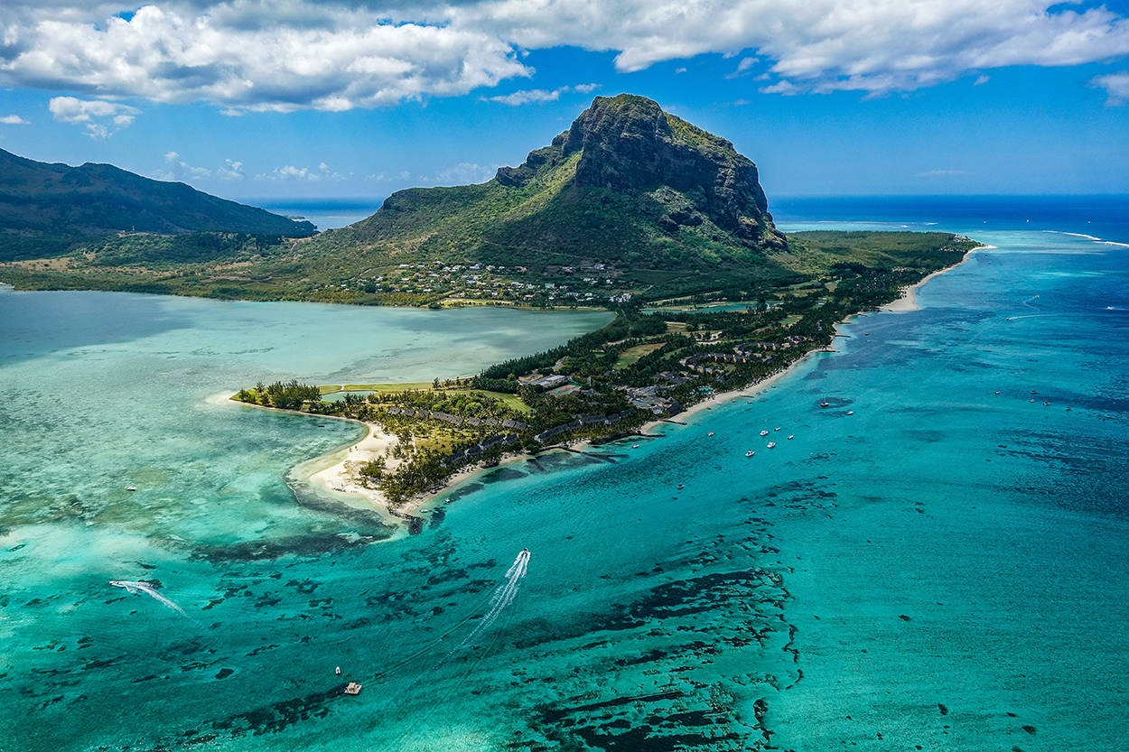 Aerial view of the island of Mauritius above the Paradis Beachcomber Golf Resort & Spa, Black River. Photo by Xavier Coiffic/Unsplash